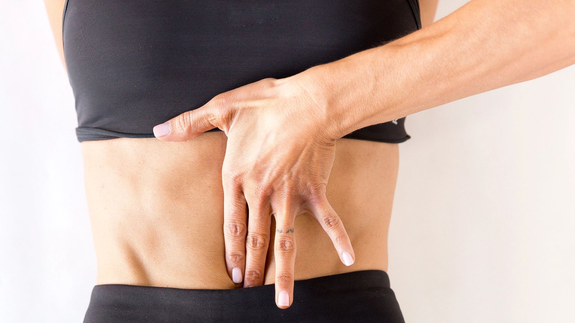 Women holding her abdomen